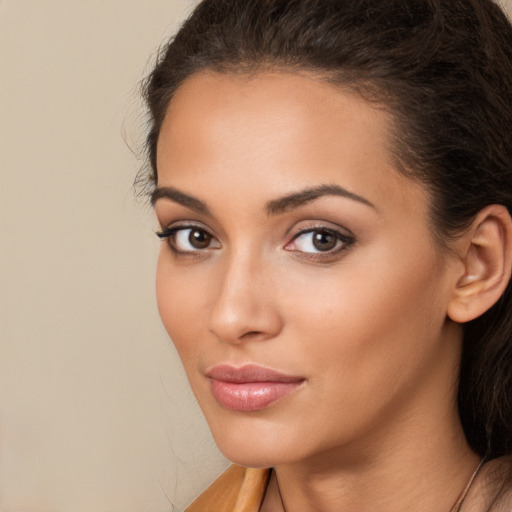 Neutral latino young-adult female with long  brown hair and brown eyes