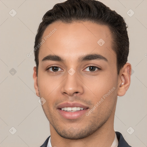 Joyful white young-adult male with short  black hair and brown eyes