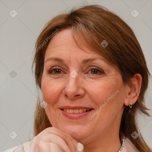 Joyful white adult female with medium  brown hair and brown eyes