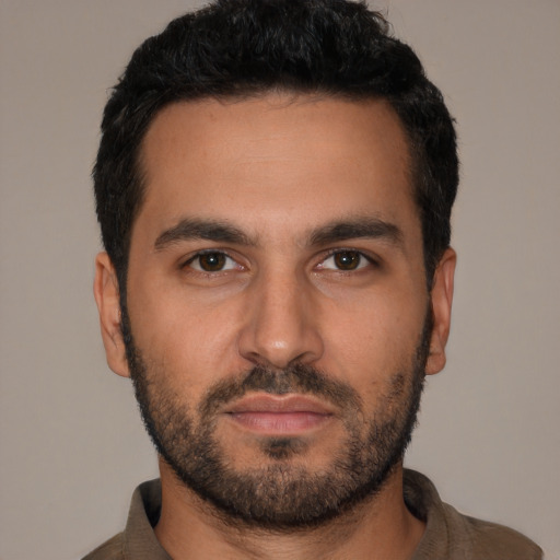 Neutral latino young-adult male with short  black hair and brown eyes