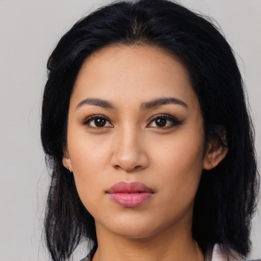 Neutral latino young-adult female with long  black hair and brown eyes