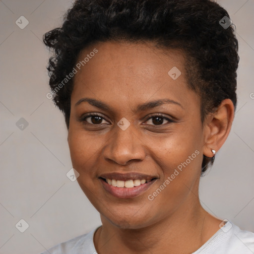 Joyful black young-adult female with short  brown hair and brown eyes
