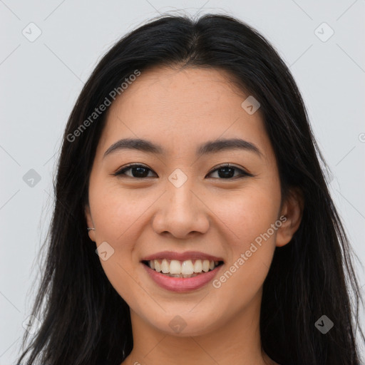 Joyful asian young-adult female with long  brown hair and brown eyes