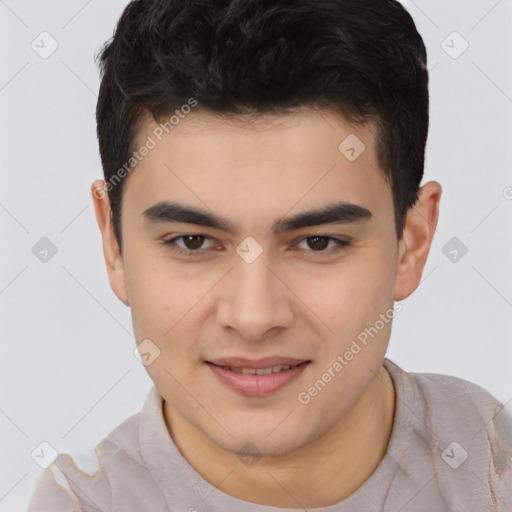 Joyful latino young-adult male with short  brown hair and brown eyes