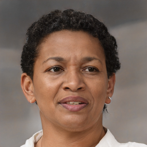 Joyful latino adult female with short  brown hair and brown eyes