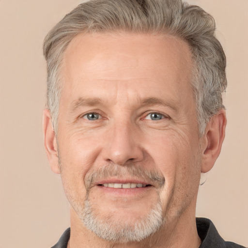 Joyful white middle-aged male with short  gray hair and grey eyes