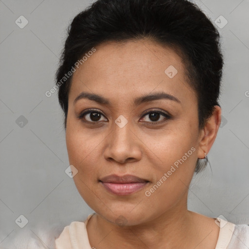 Joyful latino young-adult female with short  brown hair and brown eyes