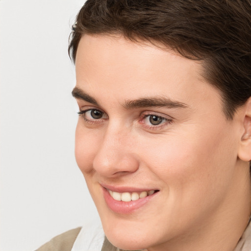 Joyful white young-adult male with medium  brown hair and brown eyes