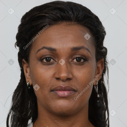 Joyful black young-adult female with long  brown hair and brown eyes