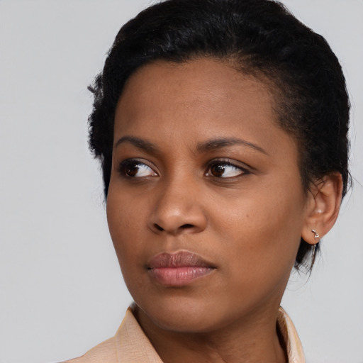 Neutral black young-adult female with medium  black hair and brown eyes