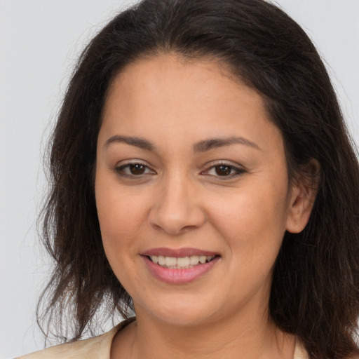 Joyful white young-adult female with long  brown hair and brown eyes