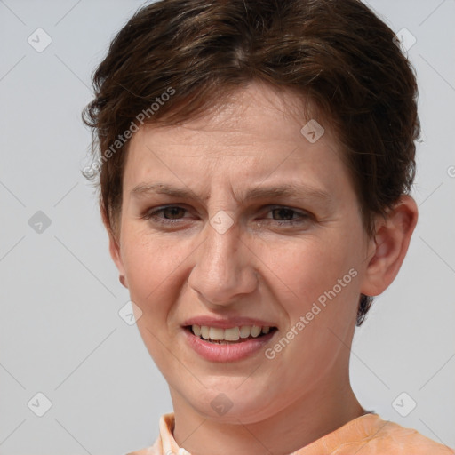 Joyful white adult female with short  brown hair and brown eyes