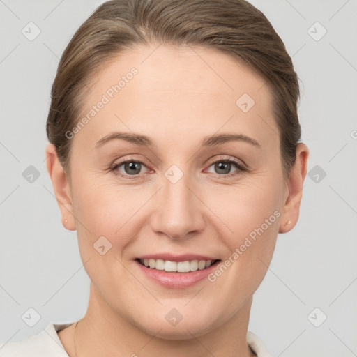 Joyful white young-adult female with short  brown hair and grey eyes