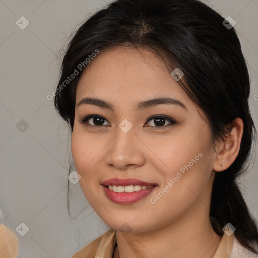 Joyful asian young-adult female with long  brown hair and brown eyes