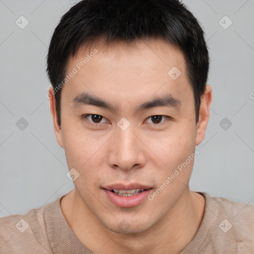 Joyful asian young-adult male with short  brown hair and brown eyes