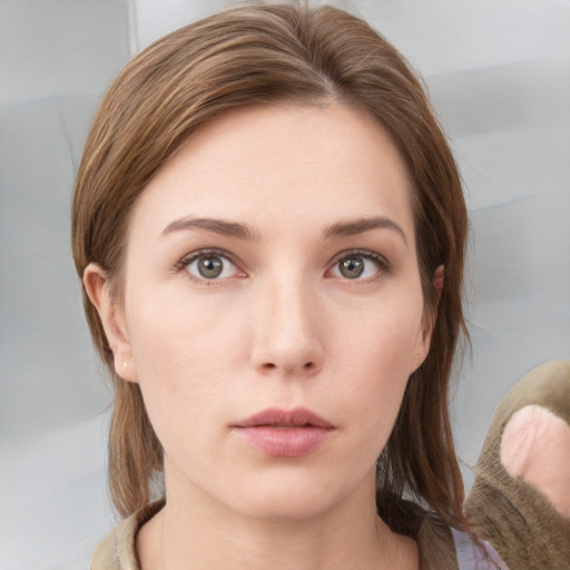 Neutral white young-adult female with medium  brown hair and grey eyes