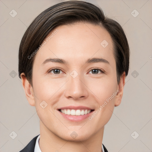 Joyful white young-adult female with short  brown hair and grey eyes