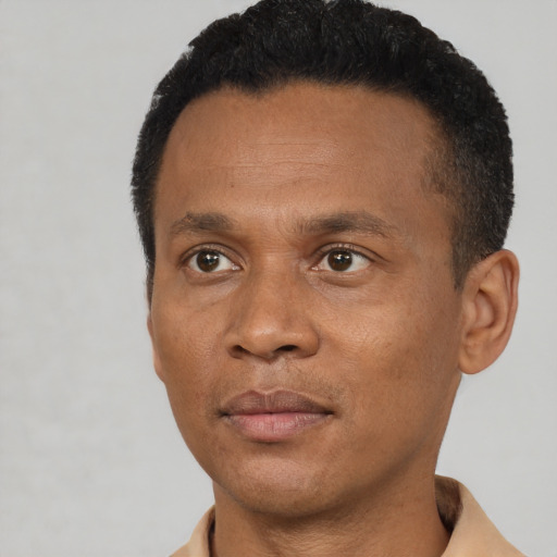 Neutral black adult male with short  brown hair and brown eyes