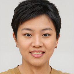 Joyful asian young-adult female with short  brown hair and brown eyes