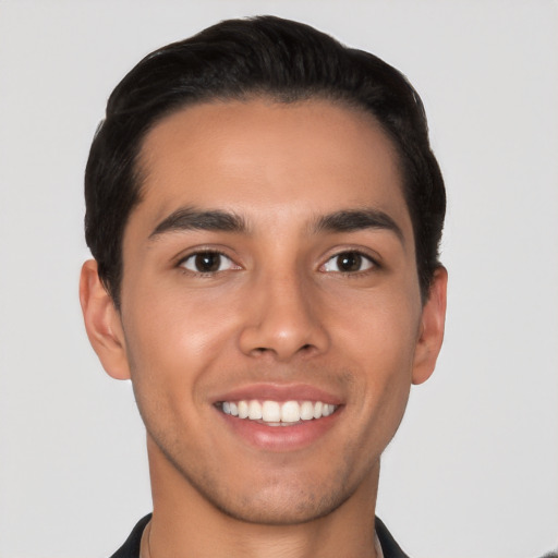 Joyful white young-adult male with short  black hair and brown eyes