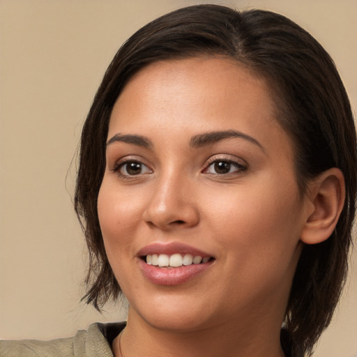 Joyful white young-adult female with medium  brown hair and brown eyes