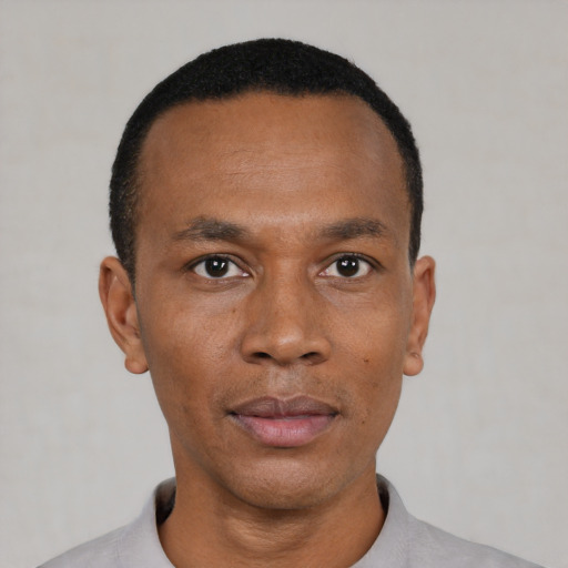 Neutral black young-adult male with short  black hair and brown eyes
