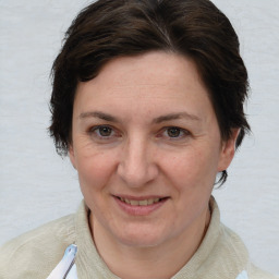 Joyful white adult female with short  brown hair and brown eyes