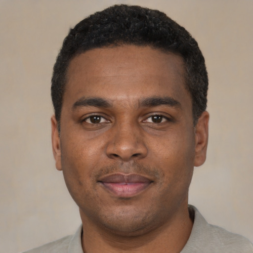 Neutral black young-adult male with short  black hair and brown eyes