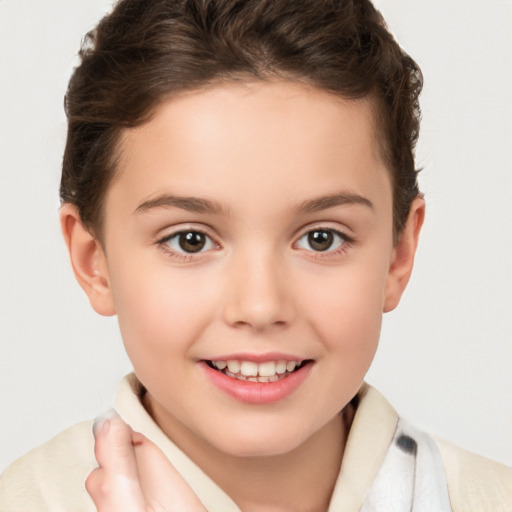 Joyful white child female with short  brown hair and brown eyes