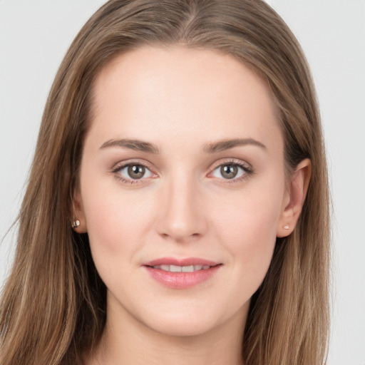 Joyful white young-adult female with long  brown hair and grey eyes