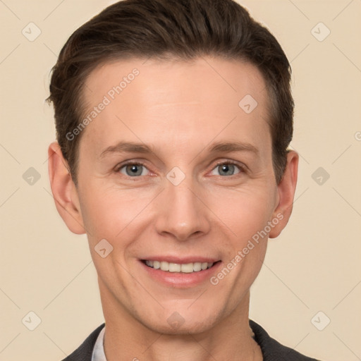 Joyful white adult male with short  brown hair and grey eyes