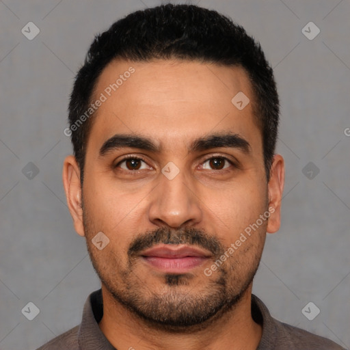 Joyful latino young-adult male with short  black hair and brown eyes