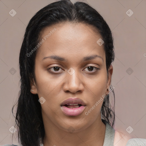 Joyful latino young-adult female with medium  brown hair and brown eyes