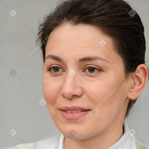 Joyful white adult female with medium  brown hair and brown eyes