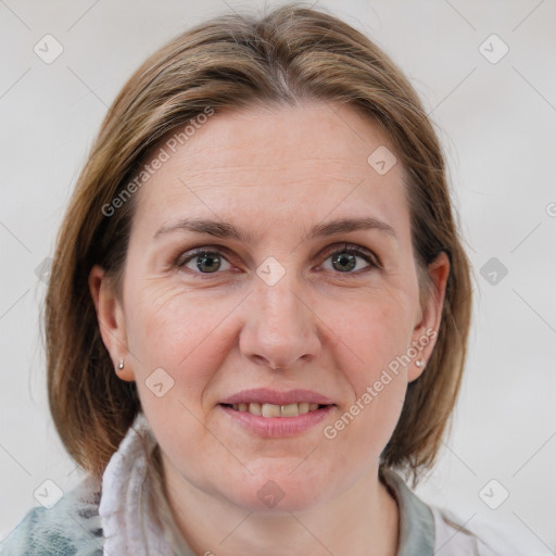 Joyful white adult female with medium  brown hair and grey eyes