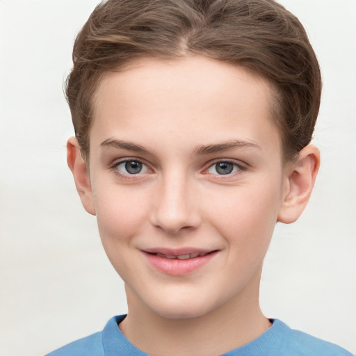 Joyful white child female with short  brown hair and grey eyes