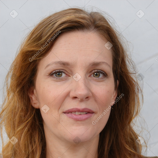 Joyful white adult female with long  brown hair and brown eyes