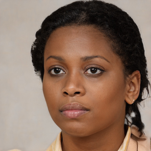 Neutral black young-adult female with medium  black hair and brown eyes
