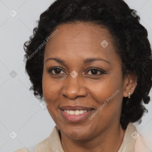 Joyful black adult female with medium  brown hair and brown eyes