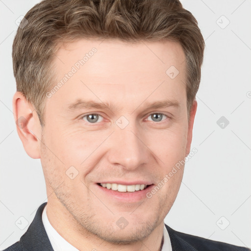 Joyful white adult male with short  brown hair and grey eyes