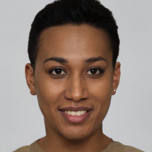 Joyful black young-adult female with short  brown hair and brown eyes