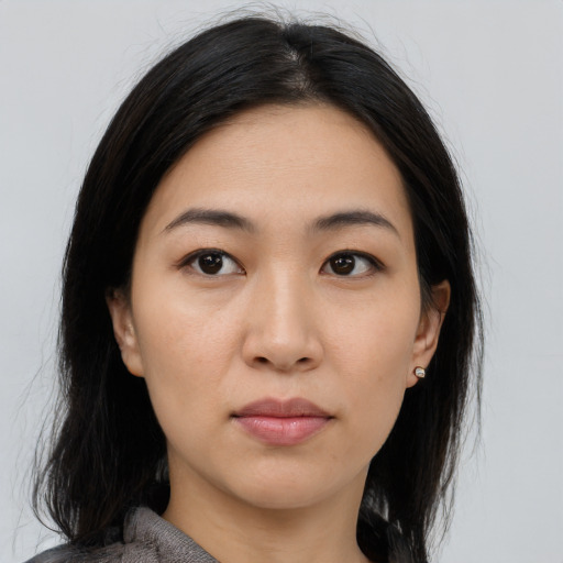 Neutral asian young-adult female with medium  black hair and brown eyes