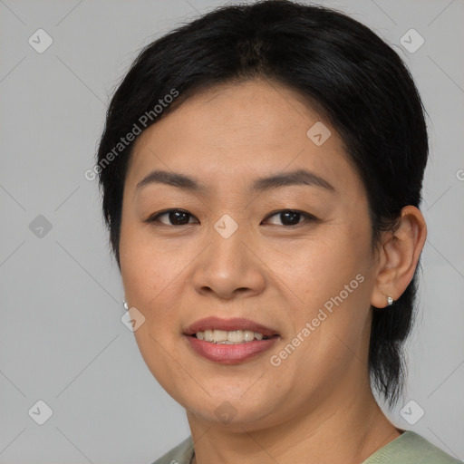 Joyful asian young-adult female with medium  brown hair and brown eyes