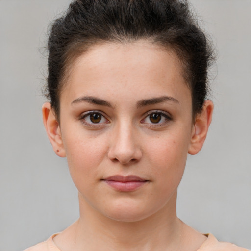 Neutral white young-adult female with short  brown hair and brown eyes