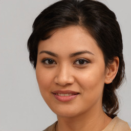 Joyful white young-adult female with medium  brown hair and brown eyes