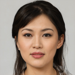 Joyful asian young-adult female with medium  brown hair and brown eyes