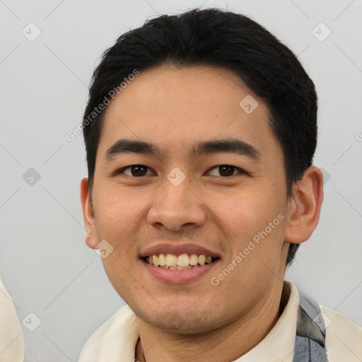 Joyful latino young-adult male with short  black hair and brown eyes