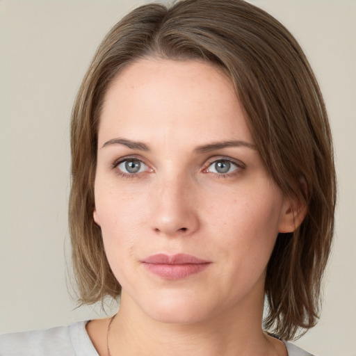 Neutral white young-adult female with medium  brown hair and grey eyes