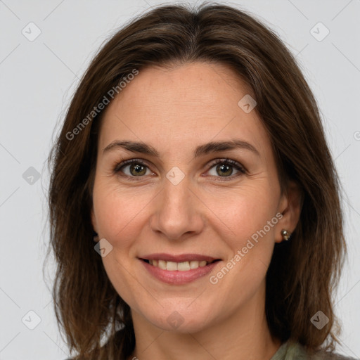 Joyful white adult female with medium  brown hair and brown eyes