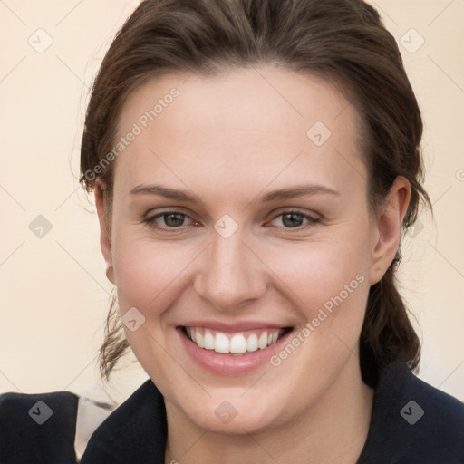 Joyful white young-adult female with long  brown hair and grey eyes